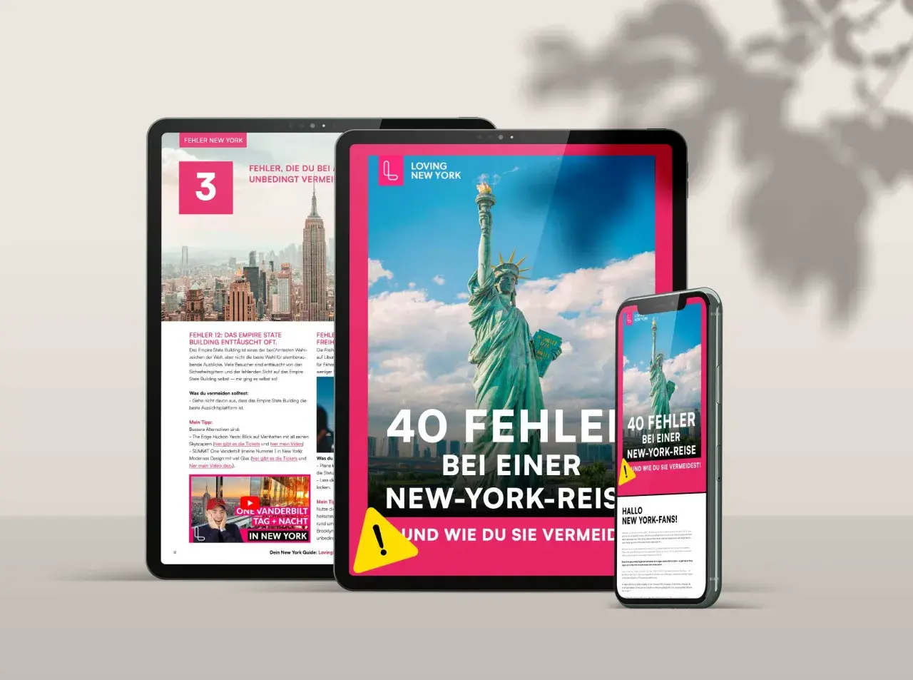 Digitale Geräte zeigen Tipps für einen USA Urlaub in New York. Die Freiheitsstatue und das Empire State Building sind zu sehen.